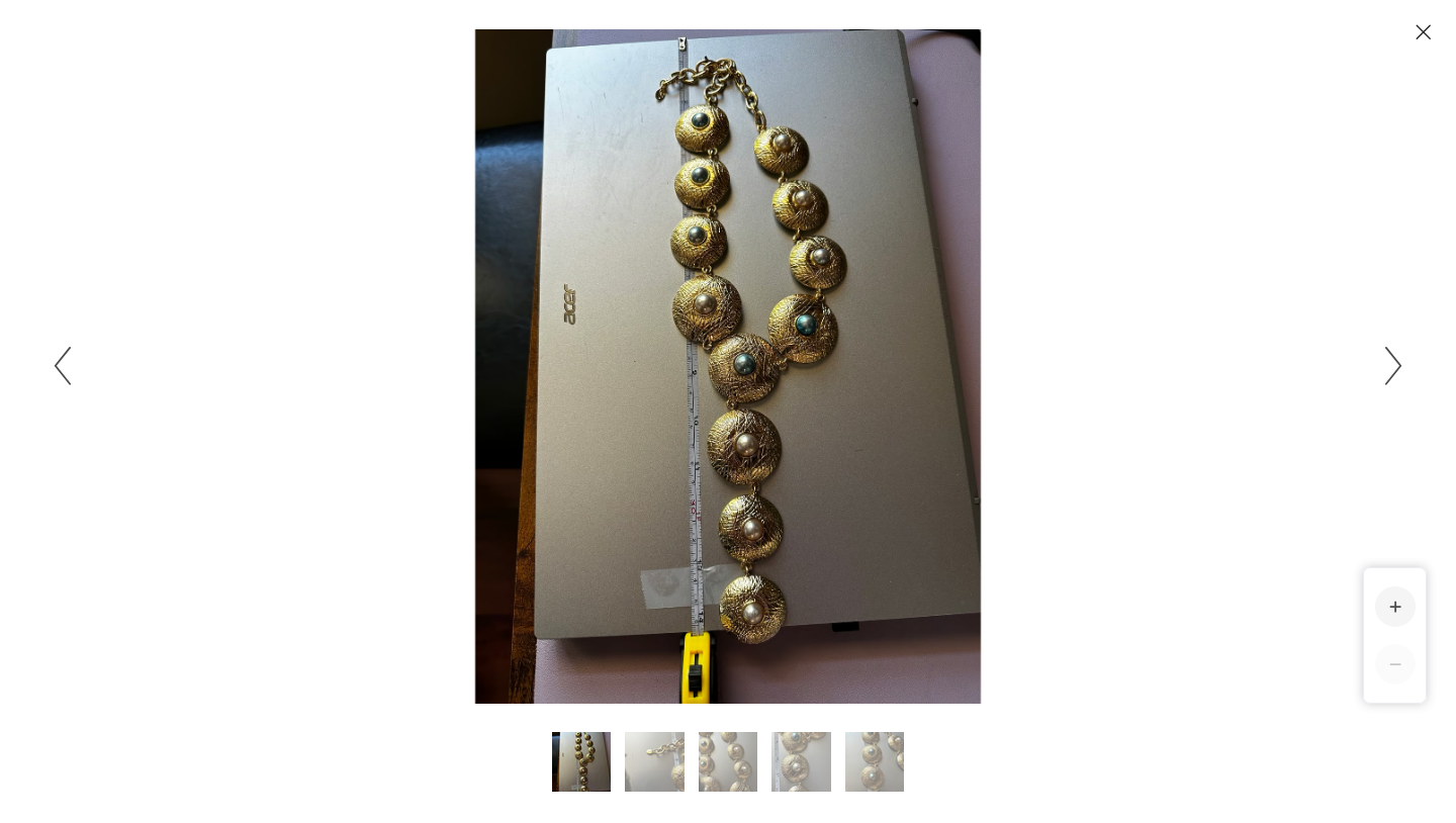 YLL WITH THE LABEL Gold 14" coin shaped necklace or belt.