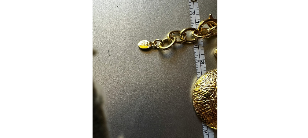 YLL WITH THE LABEL Gold 14" coin shaped necklace or belt.